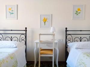 A bed or beds in a room at Affittacamere Chiti Melania