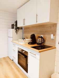 Köök või kööginurk majutusasutuses chalet bois cosy et chaleureux