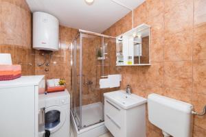 Koupelna v ubytování Apartment Orange Oasis
