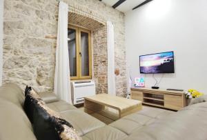 Televízia a/alebo spoločenská miestnosť v ubytovaní XY Suites - Design Apartments