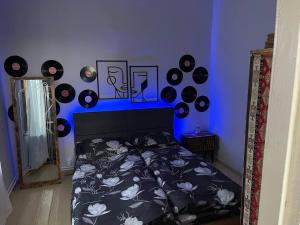 a bedroom with a bed with records on the wall at Old Gyumri in Gyumri