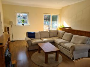 a living room with a couch and a coffee table at Quay village 16 in Westport