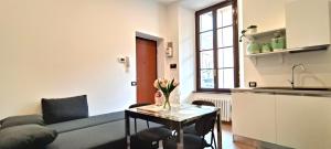 a living room with a couch and a table at Cernobbio Studio in Cernobbio