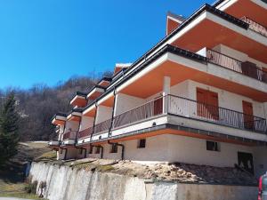 a building with balconies on the side of it at House Fiocco di Neve by Holiday World in Limone Piemonte
