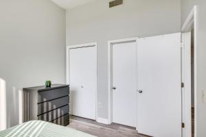 a bedroom with three closets and a bed at Columbia Vacation Rental - Walk to UofSC Campus! in Columbia