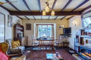 a living room with a table and chairs at 1 White Street New Quay in New Quay