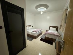 Uma cama ou camas num quarto em Hotel Ahmed Ali