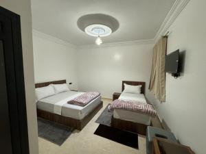 Uma cama ou camas num quarto em Hotel Ahmed Ali
