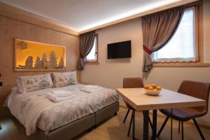 Postel nebo postele na pokoji v ubytování Chalet al Tabià