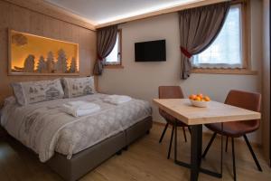 Postel nebo postele na pokoji v ubytování Chalet al Tabià