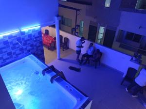 two men standing in a room with a tub at Dreimar Hotel Boutique in Cartagena de Indias