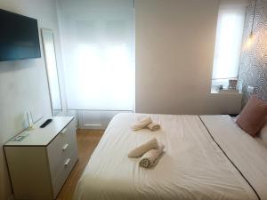 Łóżko lub łóżka w pokoju w obiekcie Rin Rooms