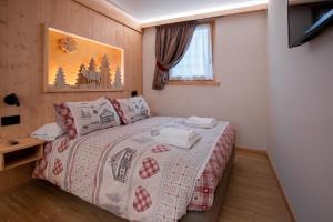 Postel nebo postele na pokoji v ubytování Chalet al Tabià