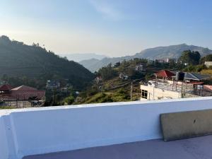 a white ledge with a view of a mountain at Valley Villa 2BHK in Kodaikānāl