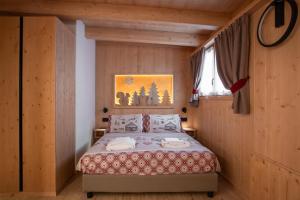 Postel nebo postele na pokoji v ubytování Chalet al Tabià