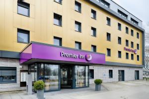 a building with a purple sign in front of it at Premier Inn Lindau in Lindau