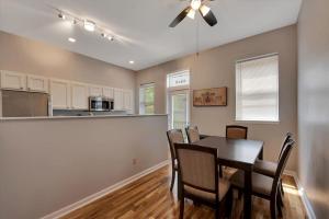 a kitchen and dining room with a table and chairs at Breathtaking Unit in Shaw - 4 Queen beds 1E in Tower Grove