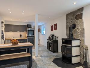 a kitchen with an old fashioned stove in a room at Storchennest in Neuried