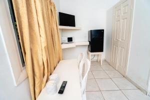 TV a/nebo společenská místnost v ubytování hotel trinidad