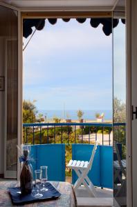 a dining table with a view of the ocean at HOTEL AZZURRA in Senigallia