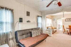 a living room with a couch and a chair at Matewan Vacation Rental Near Devil Anse Trail! 