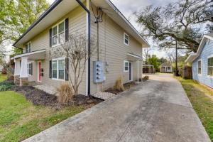 a house with a driveway in front of it at Cozy Lake Charles Apartment 2 Mi to Downtown in Lake Charles