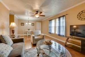 a living room with a couch and a table at Charming Lake Charles Apartment 2 Mi to Lake! in Lake Charles