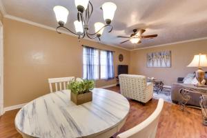 a dining room with a table and a couch at Charming Lake Charles Apartment 2 Mi to Lake! in Lake Charles
