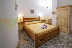Postel nebo postele na pokoji v ubytování Antico Borgo Marchese