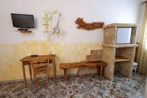 TV a/nebo společenská místnost v ubytování Antico Borgo Marchese