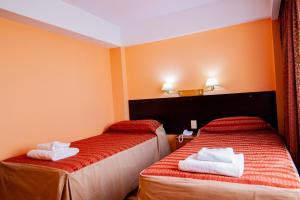 Cama ou camas em um quarto em Hotel Villa Brescia