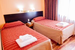 Cama ou camas em um quarto em Hotel Villa Brescia