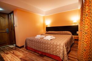 Cama ou camas em um quarto em Hotel Villa Brescia