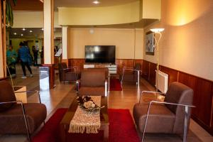 Uma TV ou centro de entretenimento em Hotel Villa Brescia