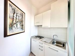 Kuchyň nebo kuchyňský kout v ubytování Golden Luxe - incredibile appartamento a 2 passi dal mare