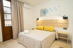 Ένα ή περισσότερα κρεβάτια σε δωμάτιο στο Hotel La Perdi