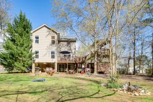 a large white house with a large yard at Pet-Friendly Lakehouse View Tower and Fire Pit! in Lake Murray Shores
