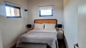 Säng eller sängar i ett rum på Apartamentos Walden by gaiarooms