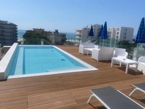 a swimming pool on the roof of a building at Hotel Villa Eugenia - 3 Stelle Superior con Private SPA e Piscina in Lido di Jesolo