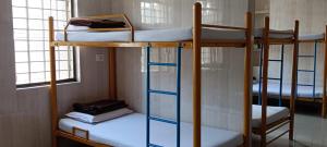 a group of bunk beds in a room at vrs dormitary in Mysore