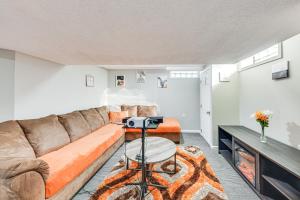 a living room with a couch and a table at 7 Mi to Lake Michigan Milwaukee Vacation Rental in Milwaukee