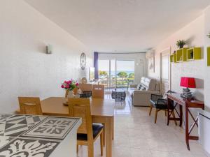 a living room and dining room with a table and chairs at Apartment Le Frémont by Interhome in Nice