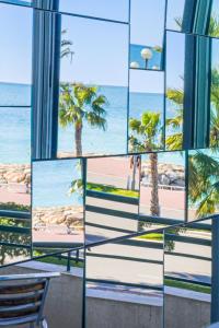 a view of the beach from a building at Studio La Joconde by Interhome in Nice