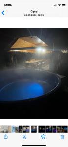 a picture of a stage with a blue pool at Casa Linistita in Chişcău