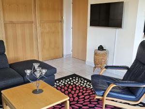a living room with a couch and chairs and a table at Holiday Home Stárkov 6 by Interhome in Stárkov