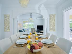 a dining room with a table with a bowl of fruit at Villa Villa Ewa by Interhome in Jávea +57 photos