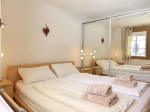Postel nebo postele na pokoji v ubytování Apartment Laerchehus Ost by Interhome