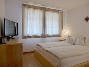 Postel nebo postele na pokoji v ubytování Apartment Laerchehus Ost by Interhome