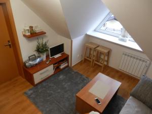 an overhead view of a living room with a tv at Apartment Peter in Donovaly