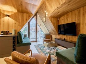 TV a/nebo společenská místnost v ubytování Apartment Máj-7 by Interhome